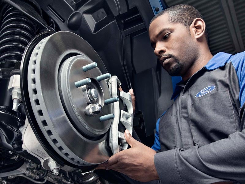 service tech working on brakes John Megel Ford in Cleveland GA